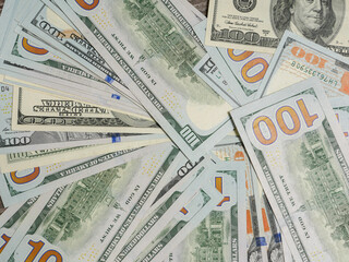 Background of 100 dollar bills, top view.