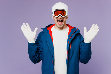 Skier surprised shocked amazed man wear warm blue windbreaker jacket ski goggles mask hat look...