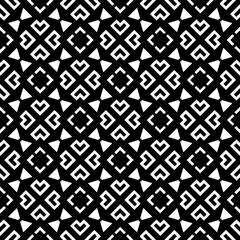 A white background with black design.Seamless texture for fashion, textile design,  on wall paper, wrapping paper, fabrics and home decor. Simple repeat pattern. Geometric patterns.