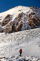 hiker in winter mountains