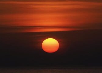 Orange Sun forms a ball during sunset