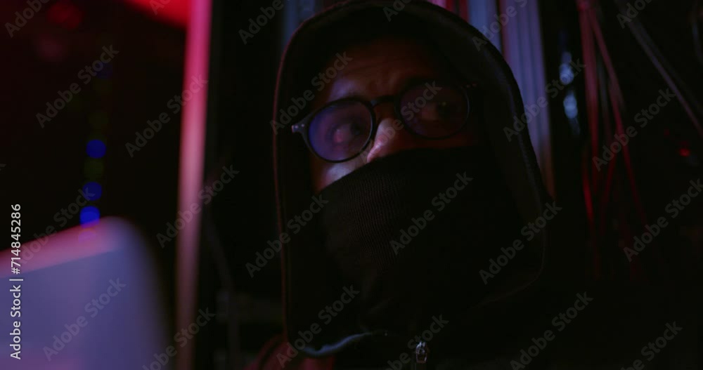 Leinwandbilder Cyber attack, hacker and person at night with online security, crime and virus installation in server room. Face mask, hacking and crypto coding with criminal, phishing and fraud hardware with tech