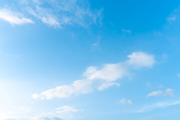 Naklejka na ściany i meble Beautiful blue sky with strange shape of clouds in the morning or evening used as natural background texture in decorative art work