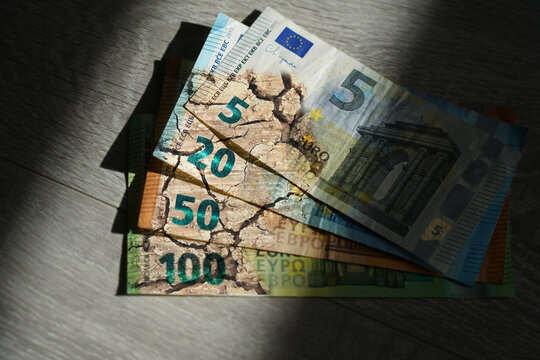 Euro loses value. The symbo of the cracked earth. The euro in the currency crisis. High inflation, depreciation, recession, weak euro, 