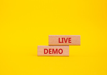 Live Demo symbol. Concept word Live Demo on wooden blocks. Beautiful yellow background. Business...