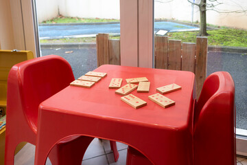 Children's dominoes on a plastic children's table