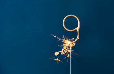 9 years celebration festive background made with Bengal fire in the form of number Nine. - obrazy, fototapety, plakaty