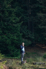 Fototapeta premium Going the distance. Shot of a young man enjoying a hike through the mountains. a handsome man with an athletic build is traveling in the mountains. landscape 