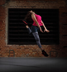 Young blonde girl jumping