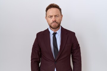Middle age business man with beard wearing suit and tie depressed and worry for distress, crying angry and afraid. sad expression.