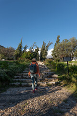 Fototapeta premium Tourist walks through the holy cemetery made in honor of the victims of an avalanche in the town of Yungay.