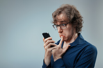 Tech-wary man shows reluctance towards smartphone