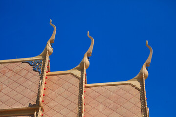 Roof detail of Thai temple,Thailand on blue sky background,Thai classic arts Gable .