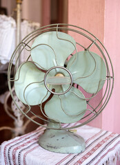 Vintage green electric fan in the pink room