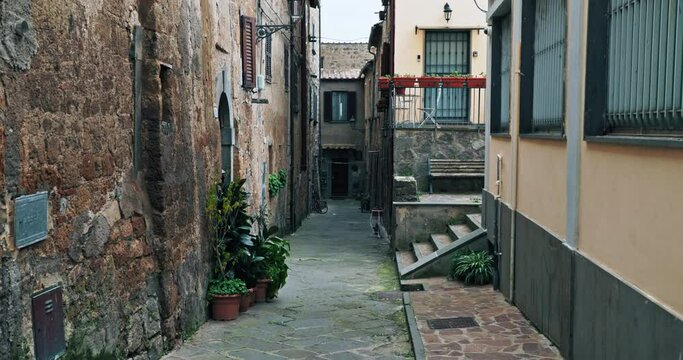 Tapestry of History: Exploring the Architectural Grandeur and Quaint Alleys of Civita di Bagnoregio, Italy. High quality 4k footage