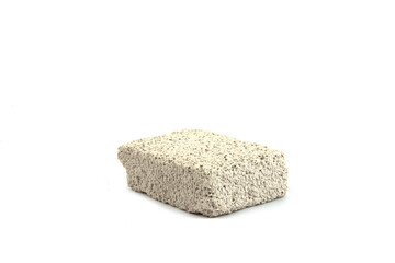 White pumice stone isolated on a white background. Mineral porous stone for foot care.