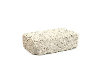 White pumice stone isolated on a white background. Mineral porous stone for foot care.