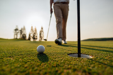 green, golf, ball, club, course, golfer, grass, sport, golfing, fairway. blurred golfer putting...