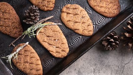 Pinecone shaped ginger snap cookies.  candied rosemary and pinecones with an antique baking pan.