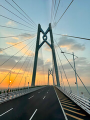 Fototapeta premium the famous Hong kong-Zhuhai-Macau Brdige or HZMB, the longest bridge in the world spanning accross 50 km above and under the ocean. Taken during beautiful sunset.