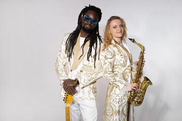 playing musical couple african man and caucasian woman on instruments	