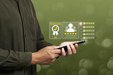 Customer hold mobilephone giving a five star rating for rating feedback scale. Concept of service rating, satisfaction and feedback