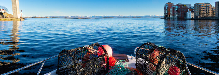 Crabpots loaded on Norway Motorboat to fish in the fjords during the winter time. Rogaland Norway