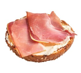 Wholegrain bagel topped with cream cheese and slices of prosciutto isolated on white
