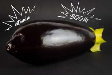 eggplant and carom looks like a mortar shell. The concept of healthy eating. On a black background.