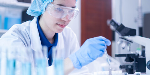 Professional scientist chemist technician analysis research experiment virus blue liquid pipette...
