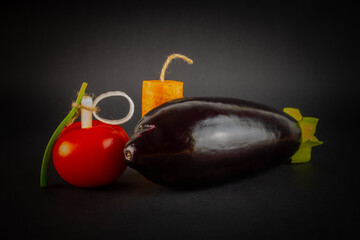 Vegetables in the form of ammunition. The concept of healthy eating. On a black background.