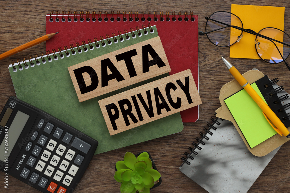 Poster data privacy red and green notepad on a work desk. text on wooden blocks