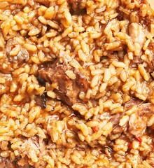 Close-up view of a traditional louisiana dish with rice, spices, and meat as a hearty meal