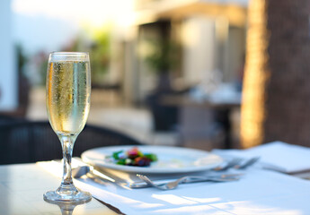Close up of dinner with champagne outdoors