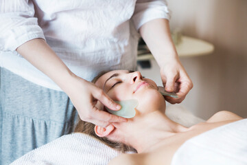 Young woman have face treatment at beauty clinic