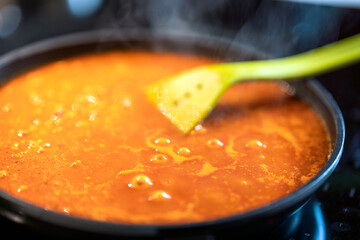 boiling mince meat and spices in frying pan.