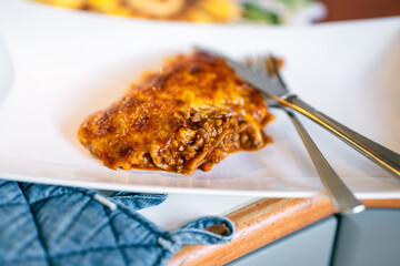 Finished lasagna added to plate.