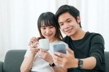 Happy Couple Sharing a Moment with Smartphone.