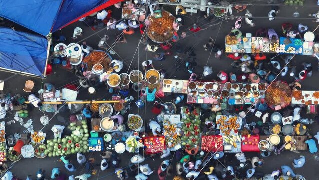 Vibrant celebration of Ramadan in Dhaka's Chalkbazar through this mesmerizing aerial view of the lively hustle and bustle of the Iftar food market.