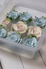 Homemade zephyr spread out on a tray. Flowers from zephyr.  Close-up.