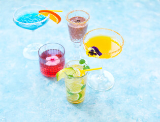 Alcohol cocktails on the turquoise background