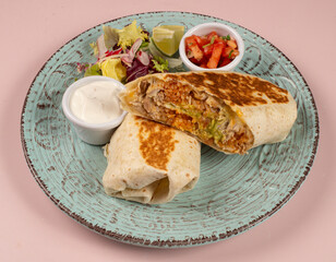 Chicken Burrito Burritos with chicken and vegetables at wooden desk close up