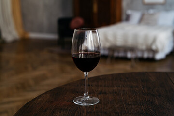 Glass with red wine in luxury settings
