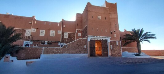 The main entrance to district of Ksar Tafilelt. With its houses made of clay and stones, typical...