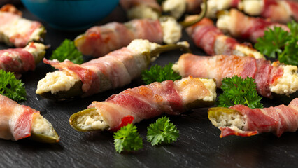 Homemade Bacon Wrapped Jalapeno Poppers with Cream Cheese and herbs.