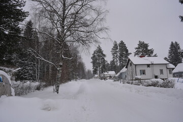 A small, cute winter town is Varkaus located in the province of North Savonia, Finland. Houses, roads, buildings, structures, trees, forests, fir trees, spruces covered with snow.