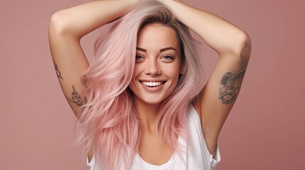 Fototapeta premium Portrait of a pleasant-looking casual woman with long hair, pink tips, tattoos on her arms, dressed in a white casual t-shirt.