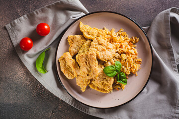 Close up of vegetarian dish stew soy steaks with rice on a plate on the table top view
