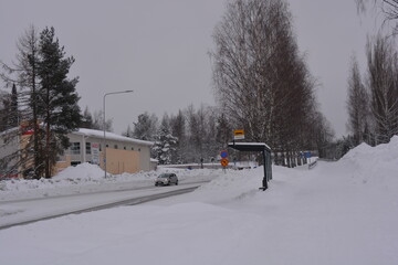 A small, cute winter town is Varkaus located in the province of North Savonia, Finland. Houses, roads, buildings, structures, trees, forests, fir trees, spruces covered with snow.