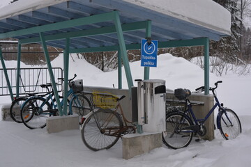 Canopy, stop, snow shelter and doge for bicycles with bicycles in the city of Varkaus, Finland.